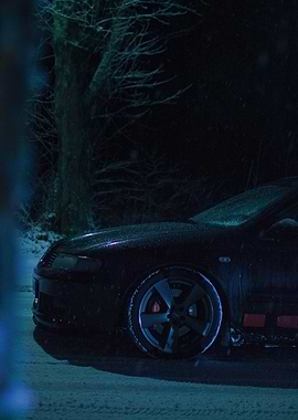 Black Car in Snowy Night