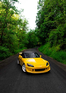 Yellow Honda S2000 on Winding Road