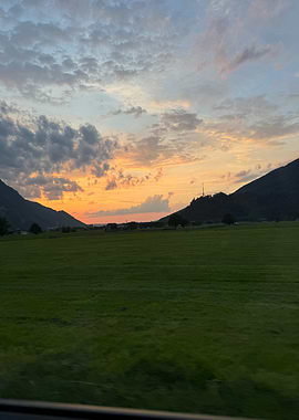 Sunset Over Green Fields