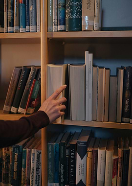 Hand Reaching for Book