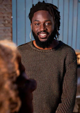 Smiling Man with Dreadlocks