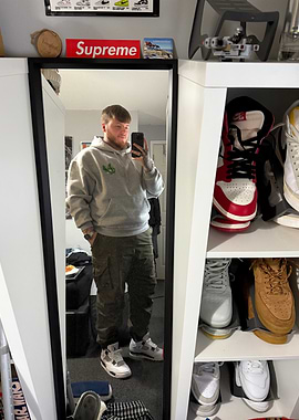 Man in Grey Hoodie and Cargo Pants