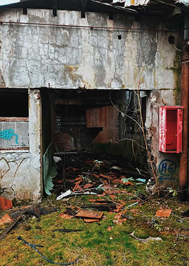 Abandoned Building Exterior with Graffiti during Urbex