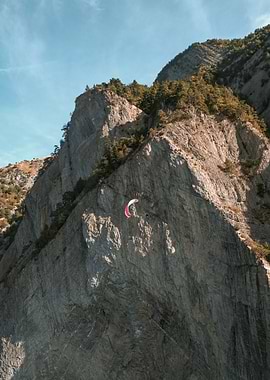 Paraglider Over Mountain