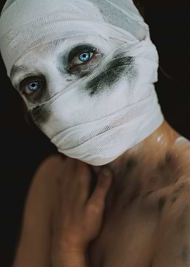 Bandaged Face with Blue Eyes