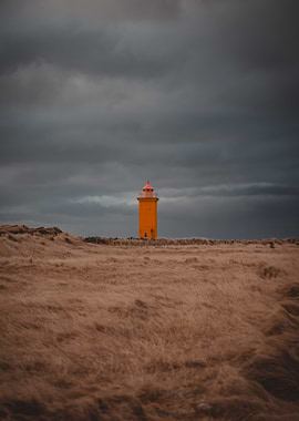 Lighthouse Under Stormy Skies