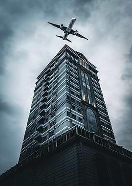 Airplane Over Skyscraper