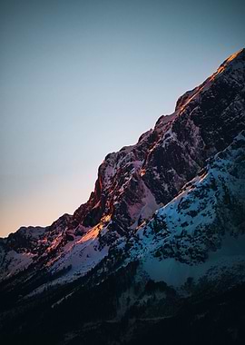 Snowy Mountain Peak at Sunset
