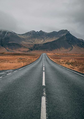 Empty Road Through Mountains