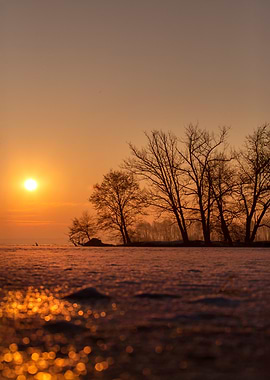 Sunset Over Frozen Lake