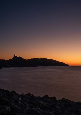 Silhouetted Coastline at Sunset