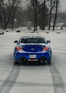 Blue Subaru BRZ in Snow