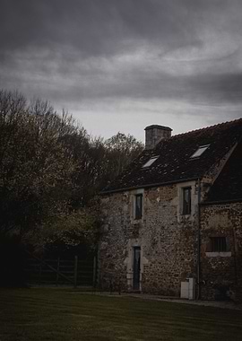 Old house under stormy clouds