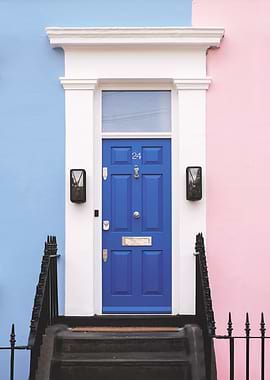 London, England I Emblematic blue door of pastel house in Notting Hill with its pink and blue façade to classic Victorian minimalist geometric colorful londoner architecture of an urban street cityscape