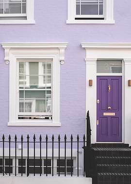 London, England I Front of a typical purple Notting Hill house with colorful brick architecture with minimalist geometric street photography at the retro vintage British vibrant mauve door