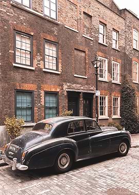 London, England I Antique car on a Shoreditch street with retro vintage aesthetic brick facades with a street photography of British minimalist geometric architecture with a moody ambience