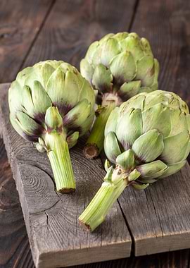 Fresh Artichokes on Wooden Board