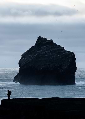 Solitary Figure by Sea Stack