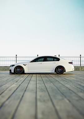 White BMW on Wooden Dock