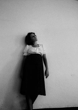 Woman in White Blouse and Skirt