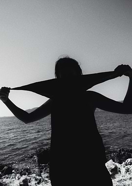 Silhouette of a Woman by the Sea
