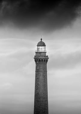 Lighthouse Under Stormy Sky