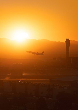 Airplane Taking Off at Sunset