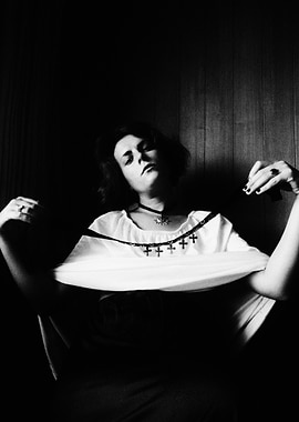 Woman in White with Cross Necklace