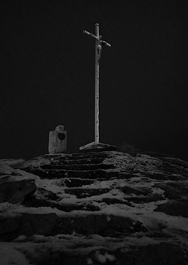 Cross on a snowy Hilltop
