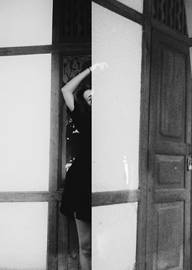 Monochrome Portrait of a Woman by Door