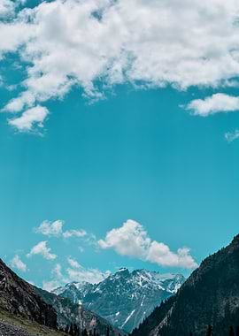 Mountain Range Under a Cloudy Sky