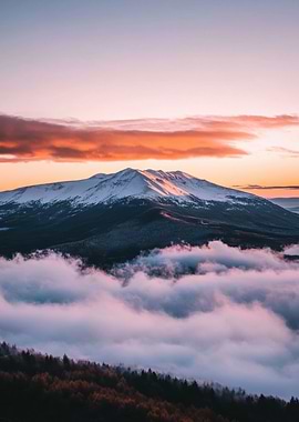 Snowy Mountain Peak Above Clouds