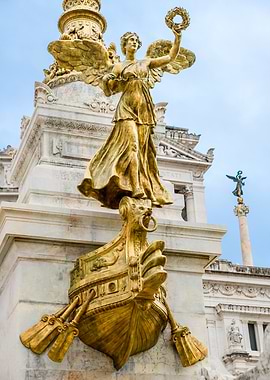 Golden Statue of Winged Woman on Monument