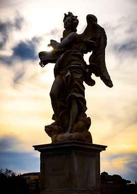 Angel Statue Against Sunset Sky