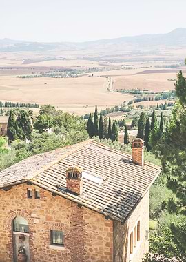 Tuscany, Italy I Scenic panoramic view from Pienza with golden fields cypress trees rustic farmhouse in warm summer light for authentic rustic rural countryside landscape photography for la dolce vita
