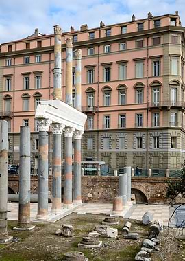 Ancient ruins with modern building backdrop