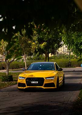 Yellow Audi RS7 in a park