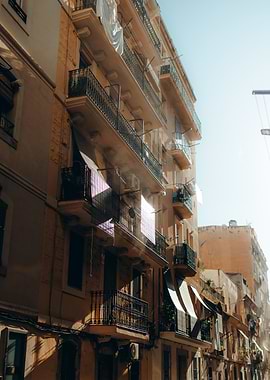 Sunlit Balconies on Historic Façade – Barcelona, Spain