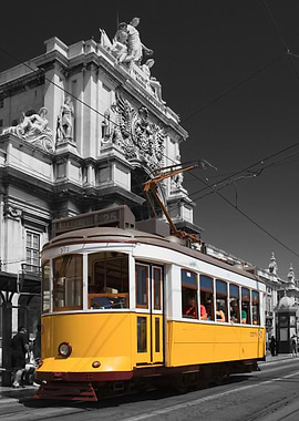 Lisbon, Portugal. Old Yellow Tram in Selective Color on a Black and White Photo of Rua Augusta Street Monumental Arch