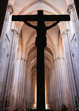Crucifix Silhouette with Jesus Christ Nailed to Cross. Gothic Monastery of Alcobaca Abbey, Portugal