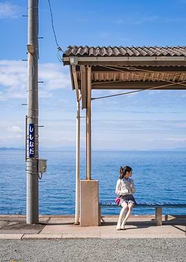 Girl at seaside train station - Japan