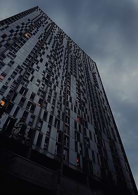 Towering Building Under Cloudy Sky