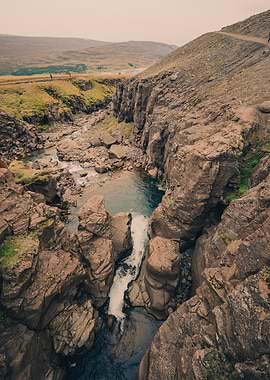 Icelandic Waterfall and Rocky Landscape