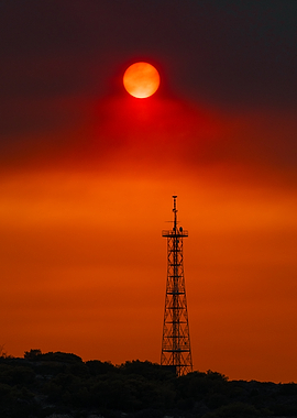 Fiery Sunset with Tower Silhouette