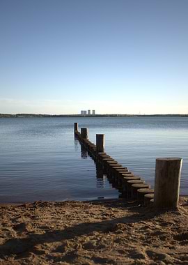 Wooden Pier on Lake with Powerplant