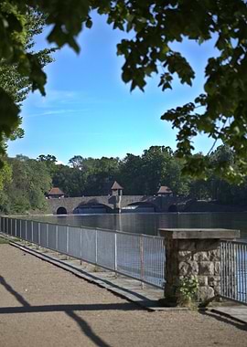 Bridge over water with trees around