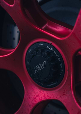 Red Car Wheel Close-Up