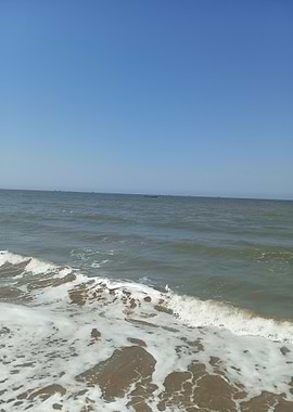 Ocean waves on a sandy beach
