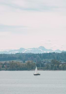 Sailboat on Lake with Mountain Backdrop