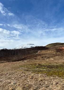 Snowy Mountain Landscape Under Blue Sky
